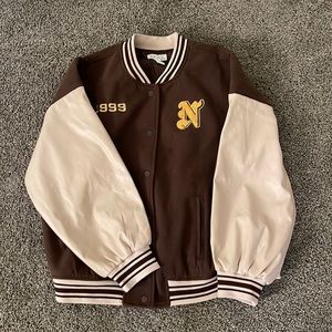 Dark brown , yellow , and tan graphic varsity jacket